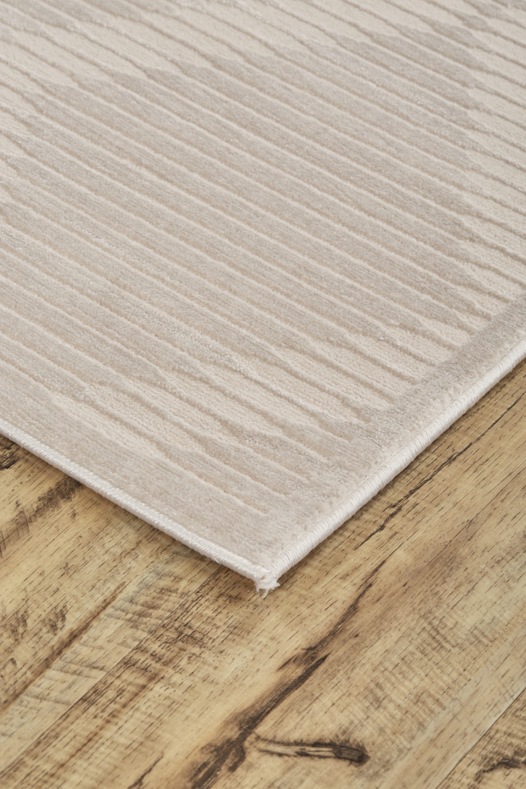 2" X 3" Ivory And Tan Geometric Stain Resistant Area Rug