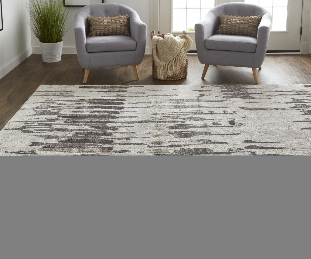 2" X 3" Gray and Ivory Abstract Power Loom Area Rug