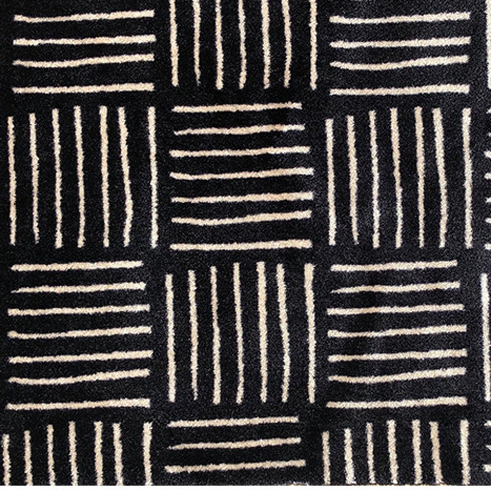 2 X 4 Black and Off White Abstract Machine Tufted Washable Area Rug With UV Protection