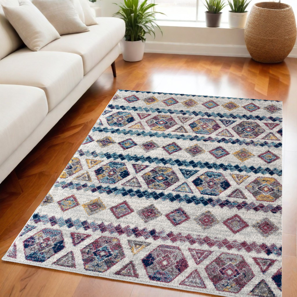 5" X 8" Ivory Blue and Orange Geometric Power Loom Area Rug