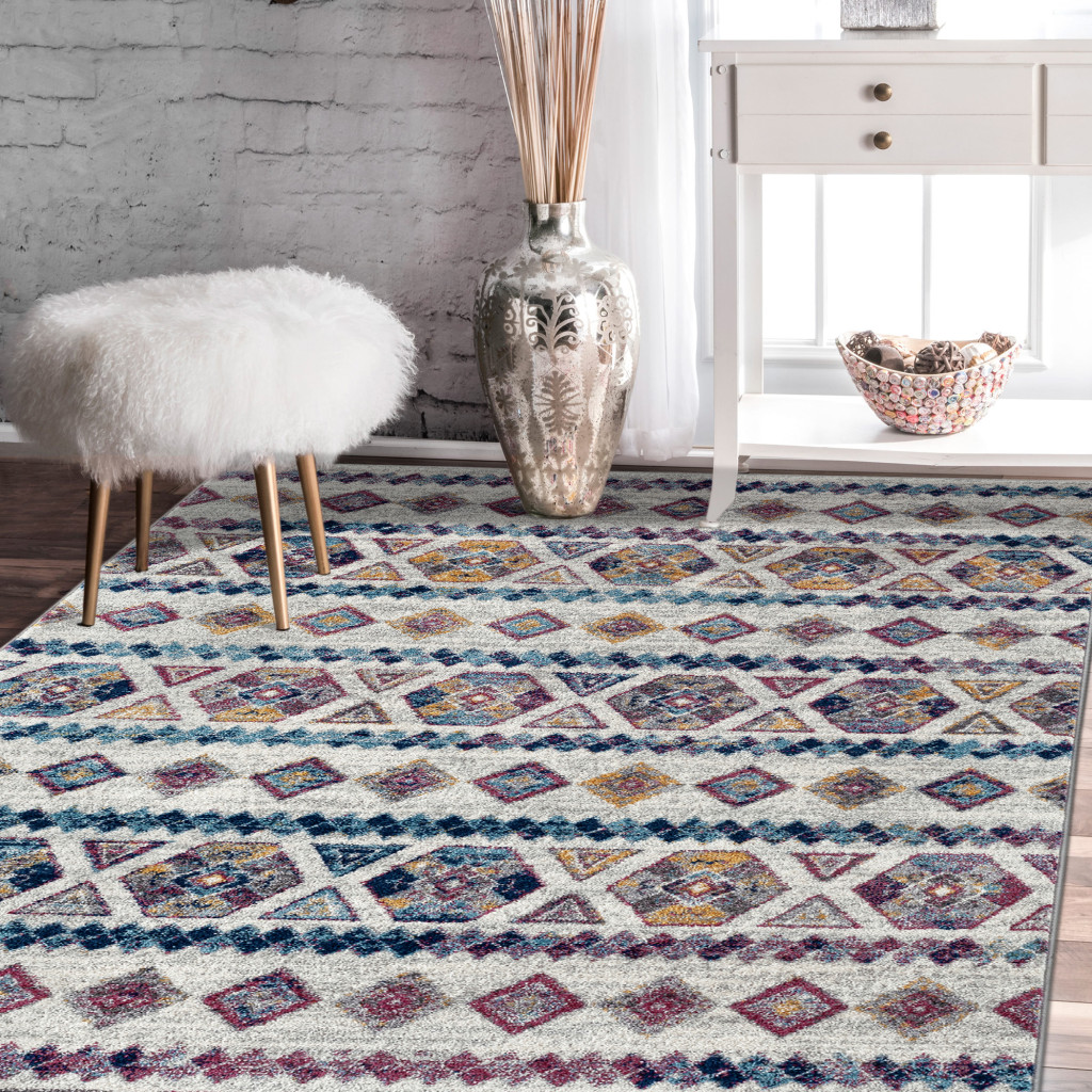 9" X 12" Ivory Blue and Orange Geometric Power Loom Area Rug
