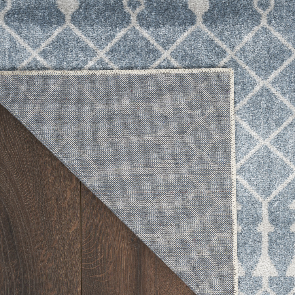7" X 9" Blue and Ivory Abstract Power Loom Washable Area Rug