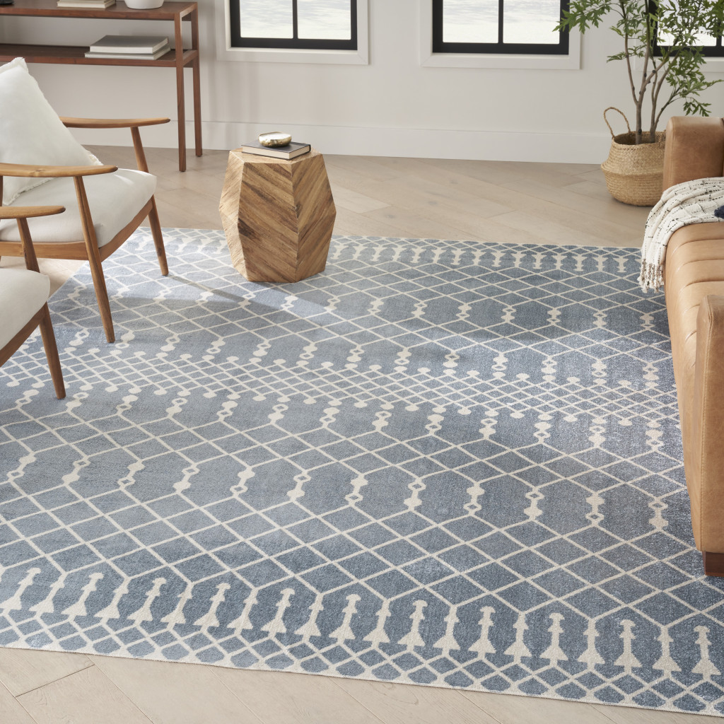 7" X 9" Blue and Ivory Abstract Power Loom Washable Area Rug