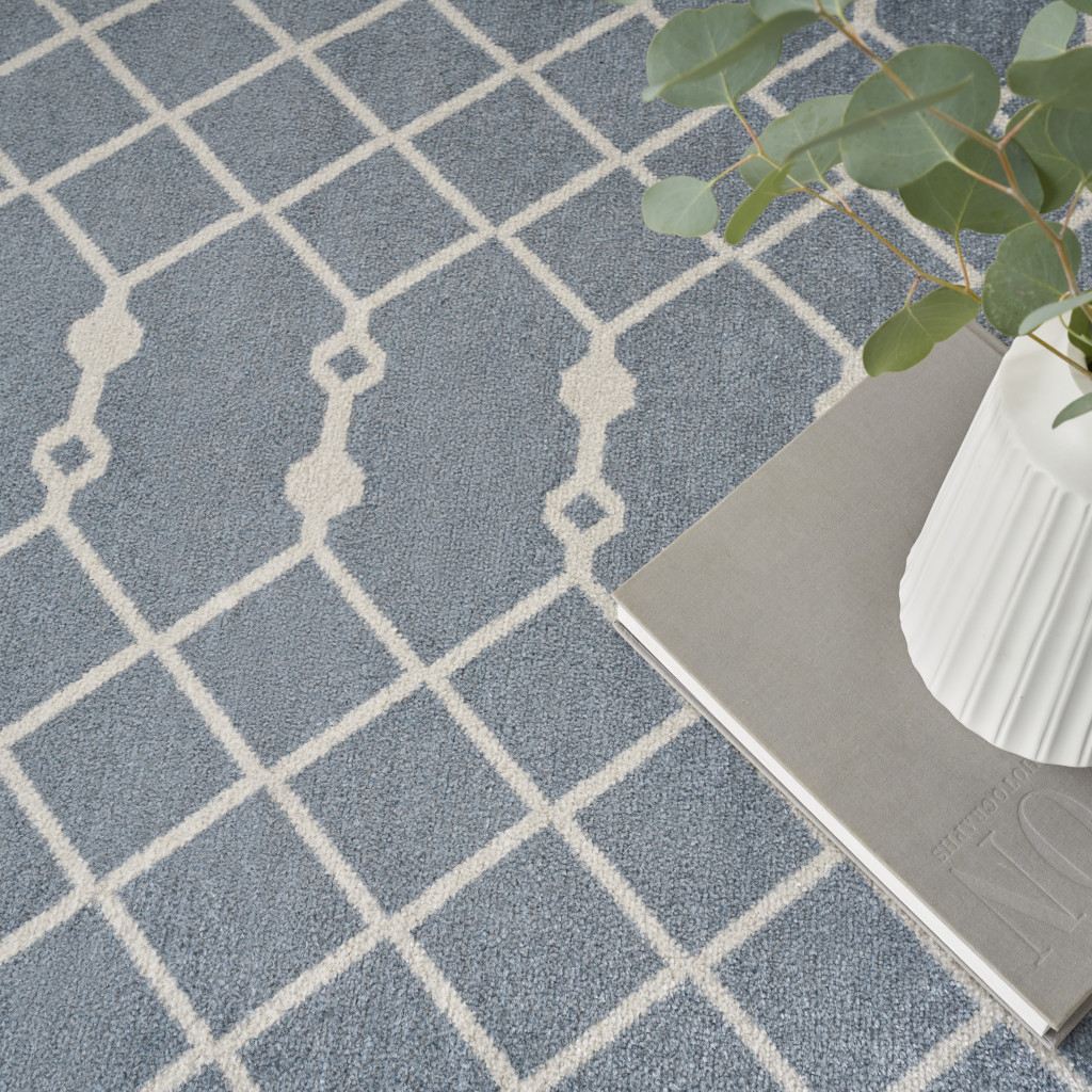 7" X 9" Blue and Ivory Abstract Power Loom Washable Area Rug