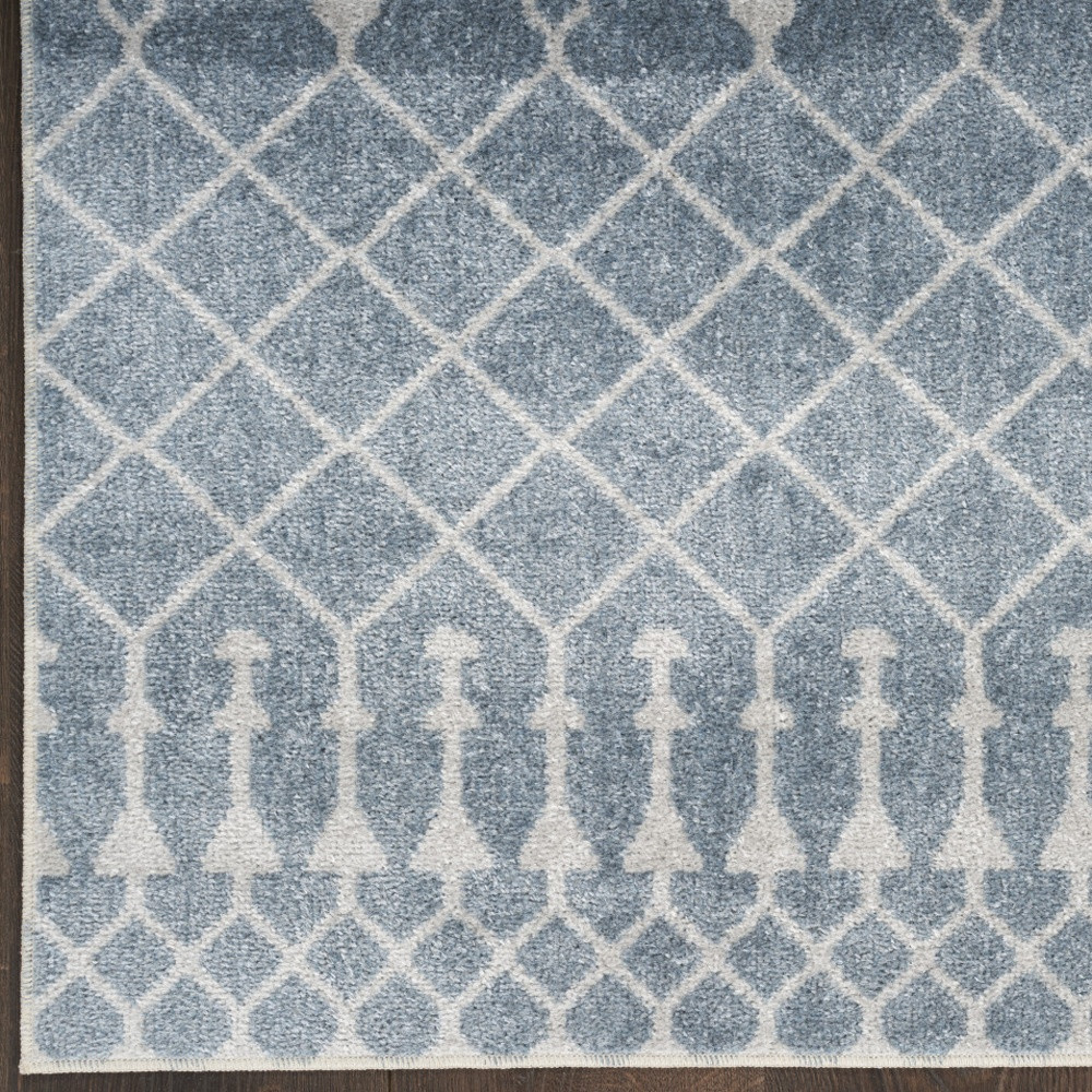 7" X 9" Blue and Ivory Abstract Power Loom Washable Area Rug