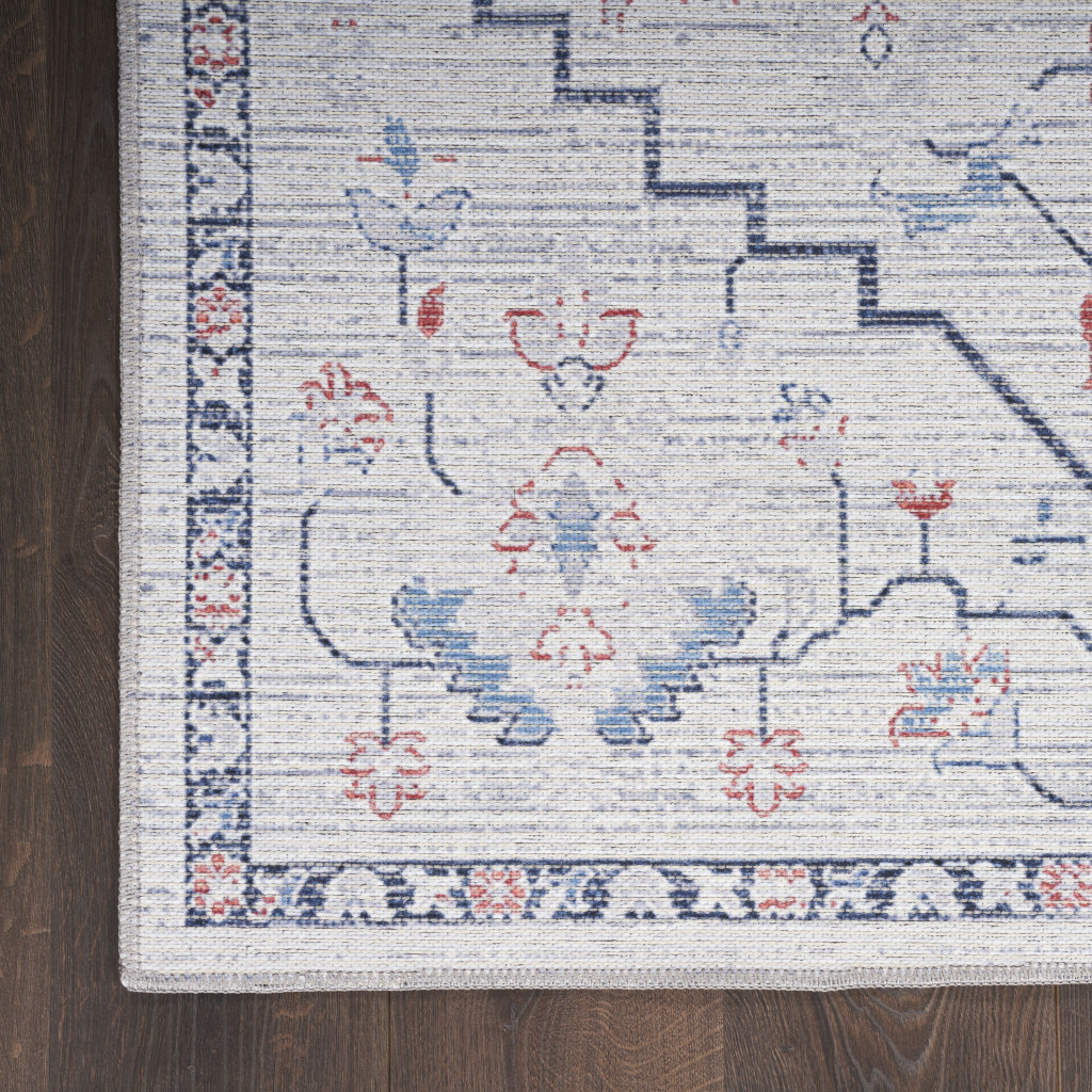 6" X 9" Ivory and Blue Oriental Power Loom Washable Area Rug