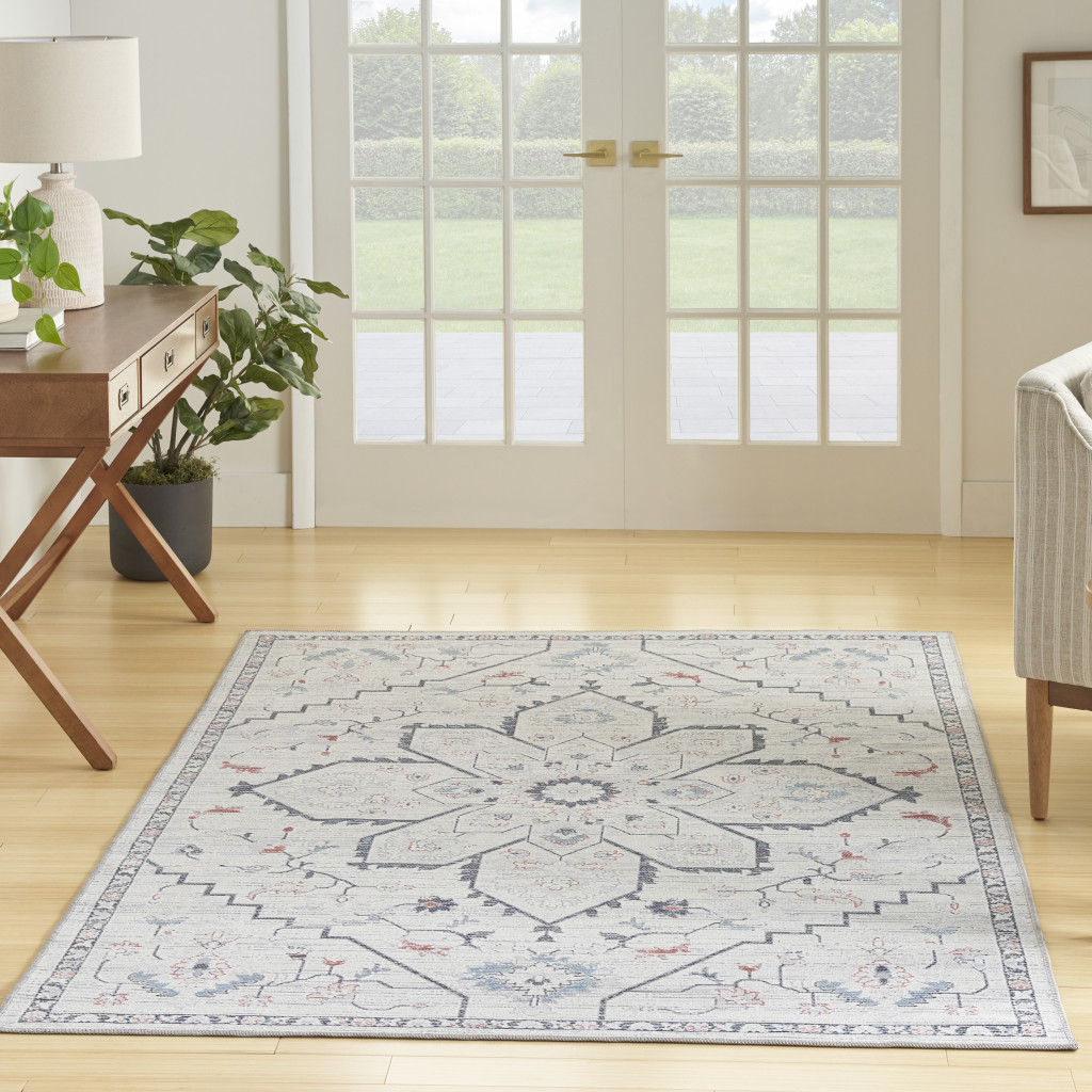 6" X 9" Ivory and Blue Oriental Power Loom Washable Area Rug