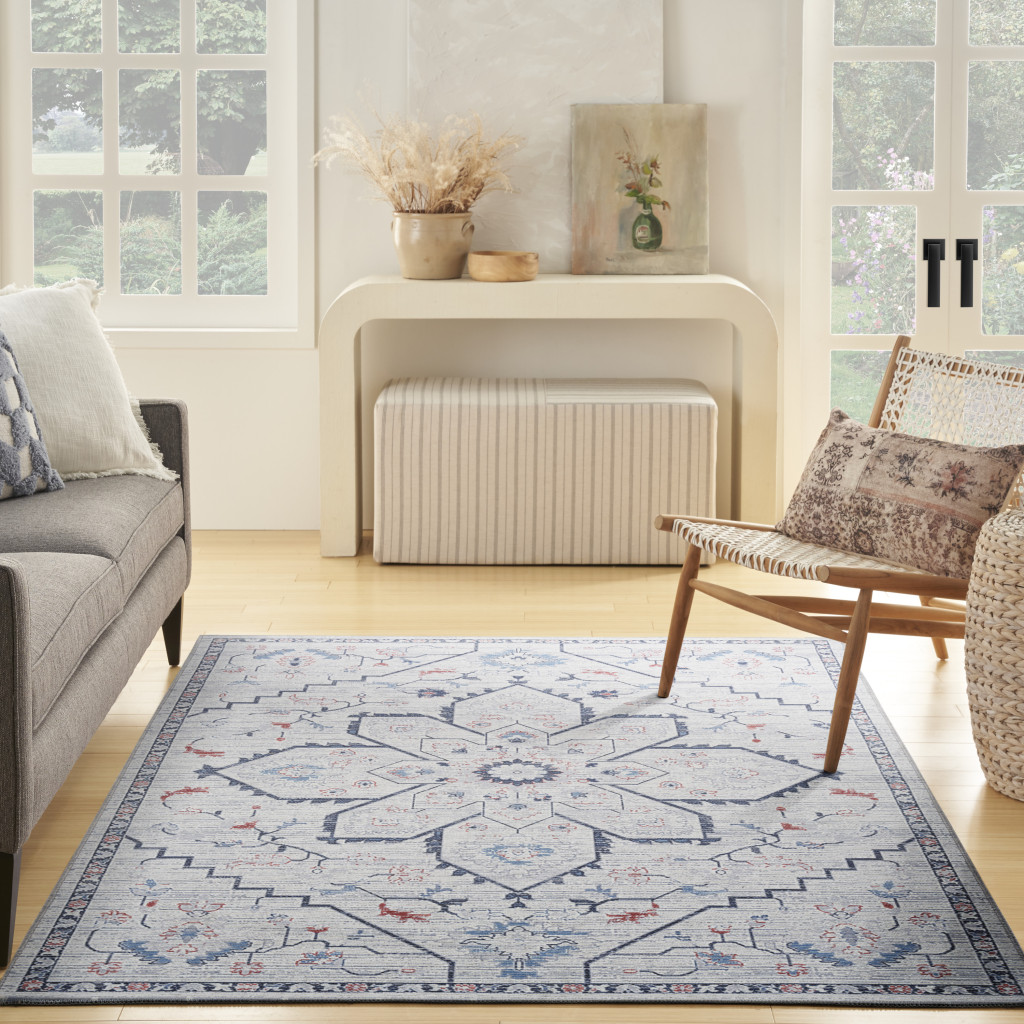 6" X 9" Ivory and Blue Oriental Power Loom Washable Area Rug