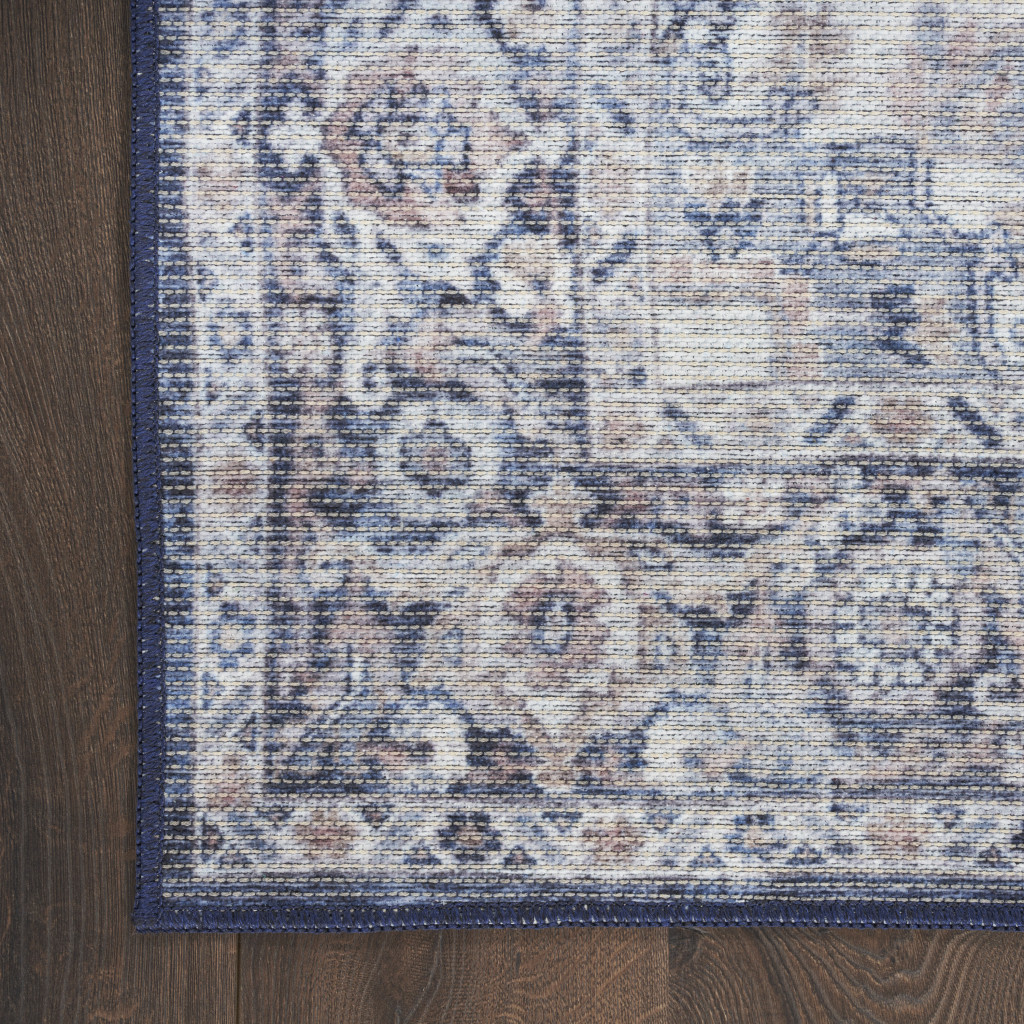 8 Blue and Ivory Floral Power Loom Distressed Washable Runner Rug
