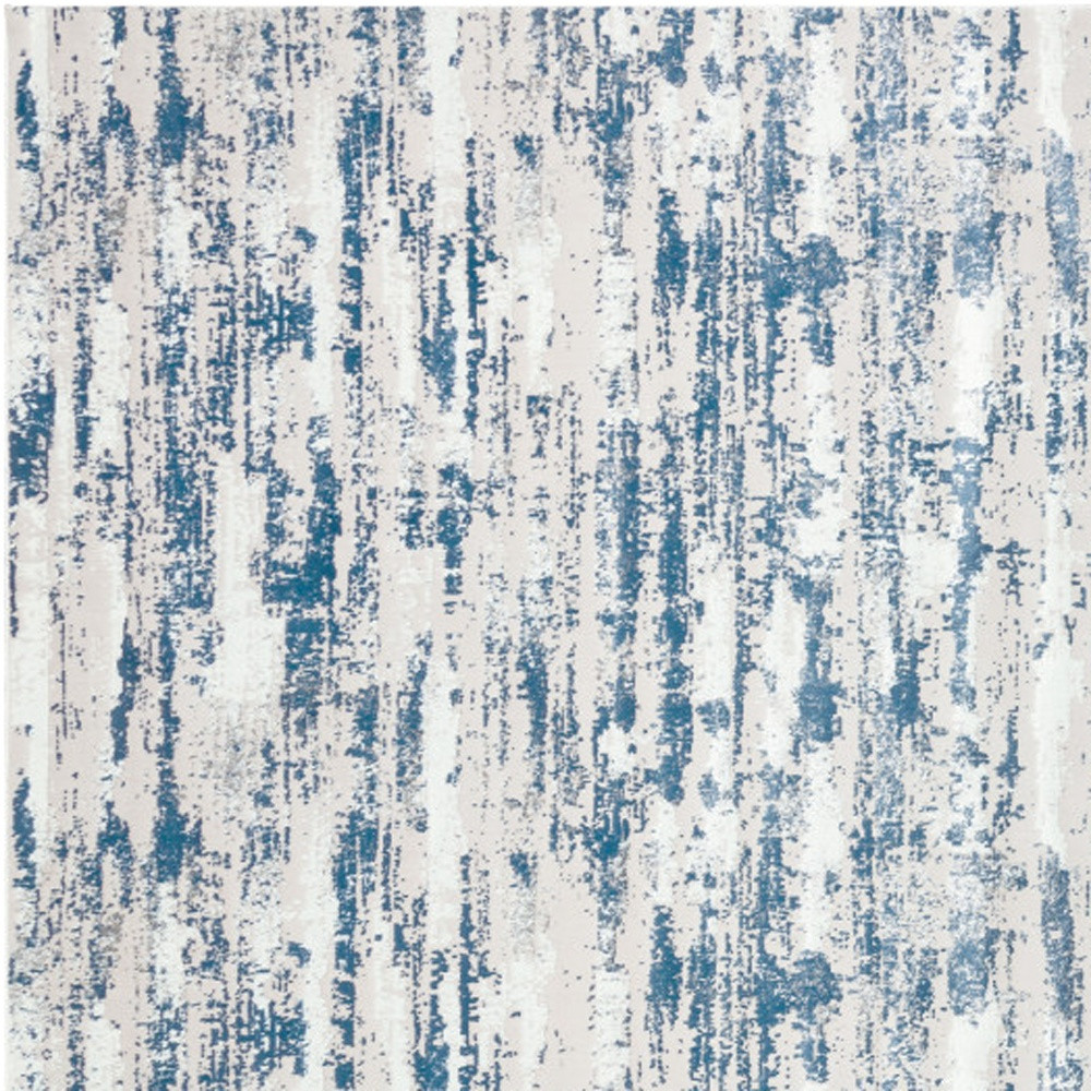 4" X 6" Blue and Ivory Abstract Washable Non Skid Area Rug