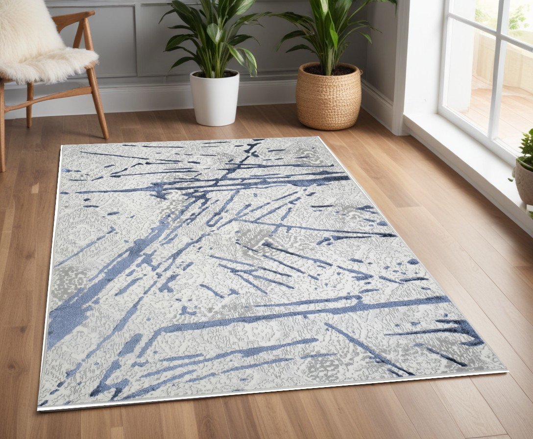 4" X 6" Ivory and Blue Abstract Area Rug