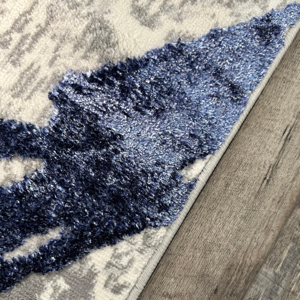 8" X 11" Ivory and Blue Abstract Area Rug