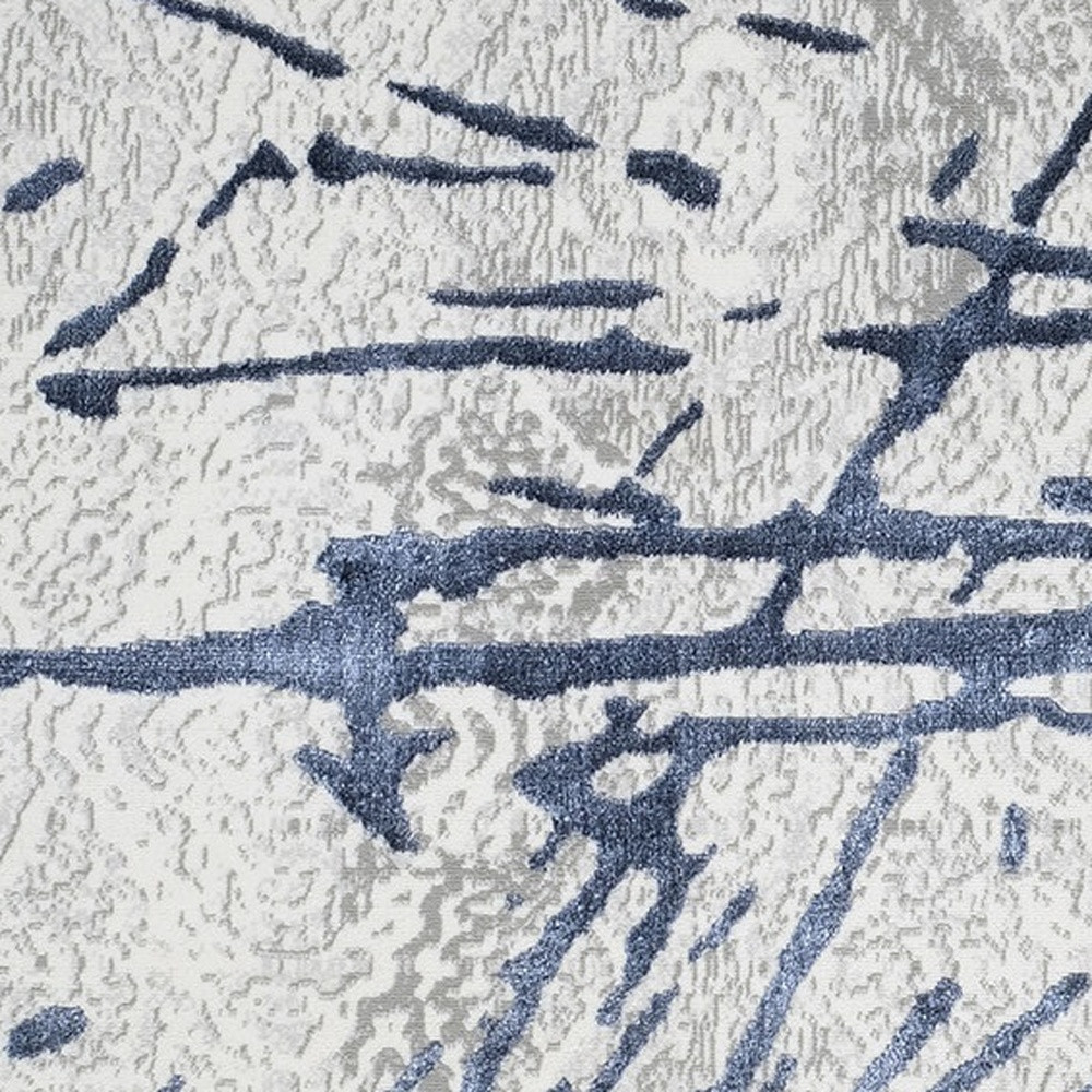 9" X 12" Ivory and Blue Abstract Area Rug