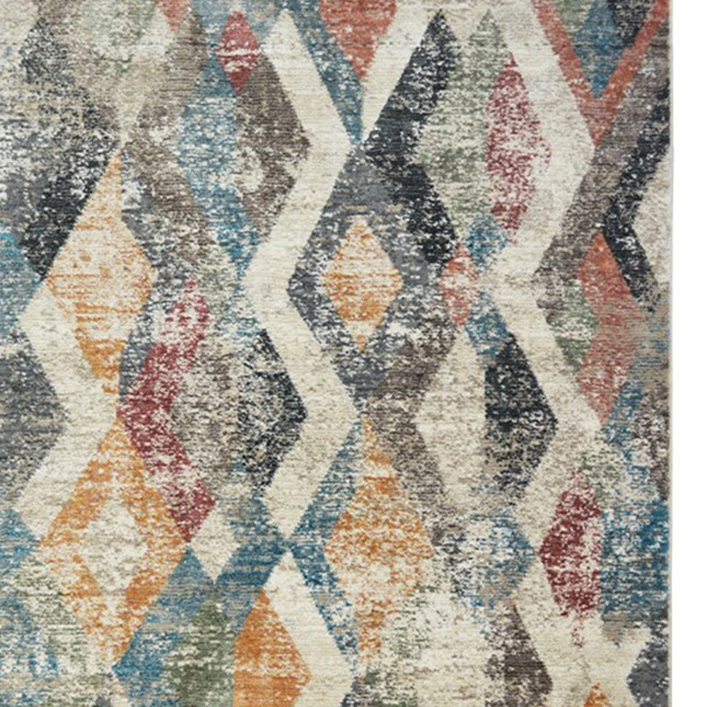 2" X 3" Beige Blue and Gray Geometric Distressed Area Rug With Fringe
