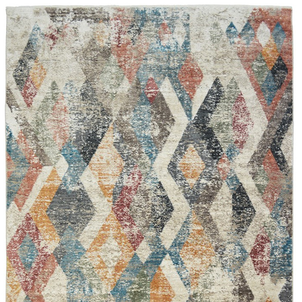2" X 3" Beige Blue and Gray Geometric Distressed Area Rug With Fringe