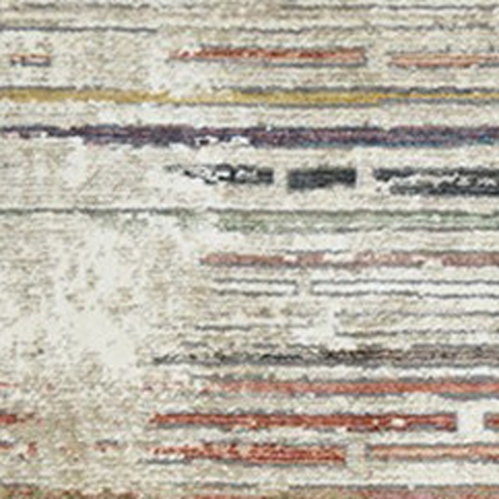 2" X 3" Beige Geometric Distressed Area Rug With Fringe