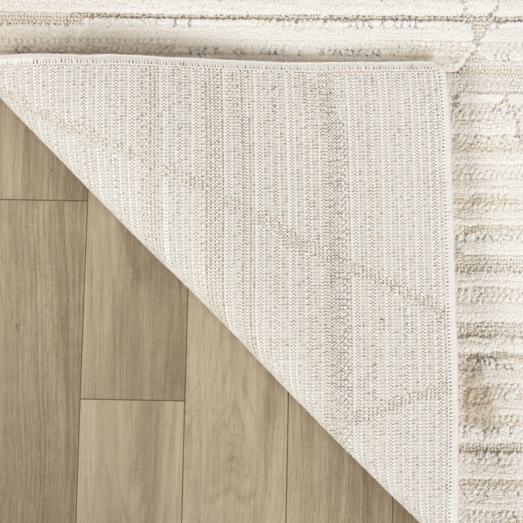 5" X 8" Cream and Beige Geometric Area Rug
