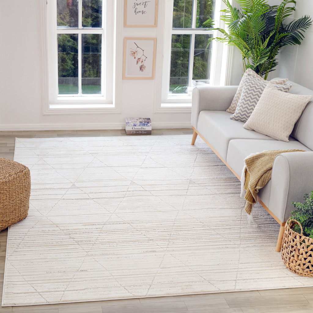 5" X 8" Cream and Beige Geometric Area Rug