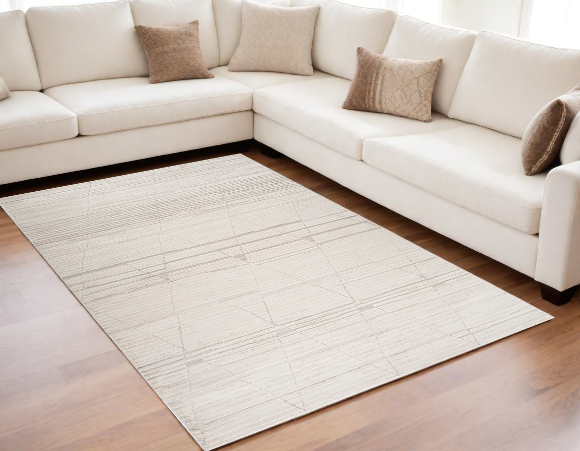 5" X 8" Cream and Beige Geometric Area Rug