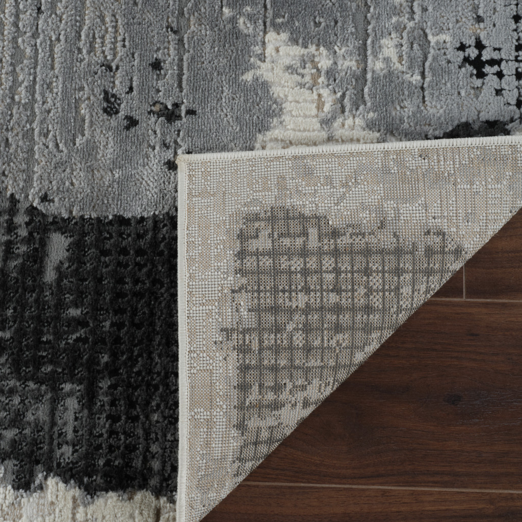 7" X 10" Beige and Black Abstract Distressed Area Rug