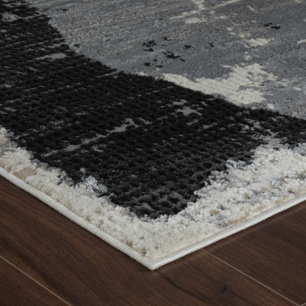 8" X 11" Beige and Black Abstract Distressed Area Rug