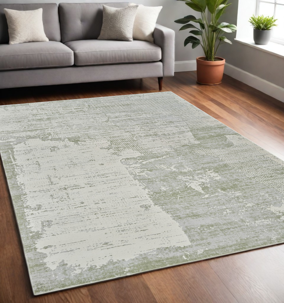 5" X 8" Beige and Green Abstract Distressed Area Rug