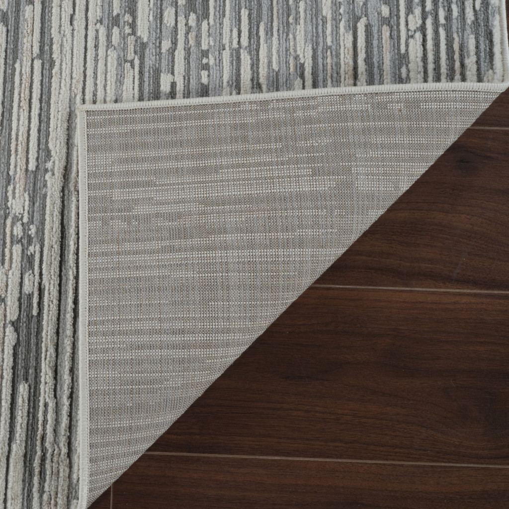 5" X 8" Beige and Brown Abstract Distressed Area Rug