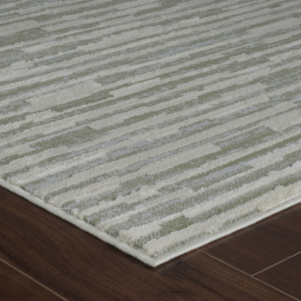 4" X 6" Beige and Green Abstract Distressed Area Rug