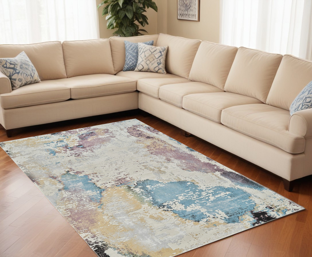 5" X 8" Beige and Blue Abstract Distressed Area Rug
