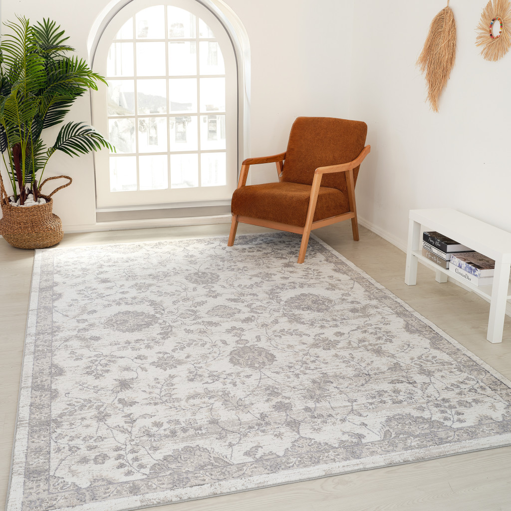 4" X 6" Beige and Gray Floral Distressed Area Rug