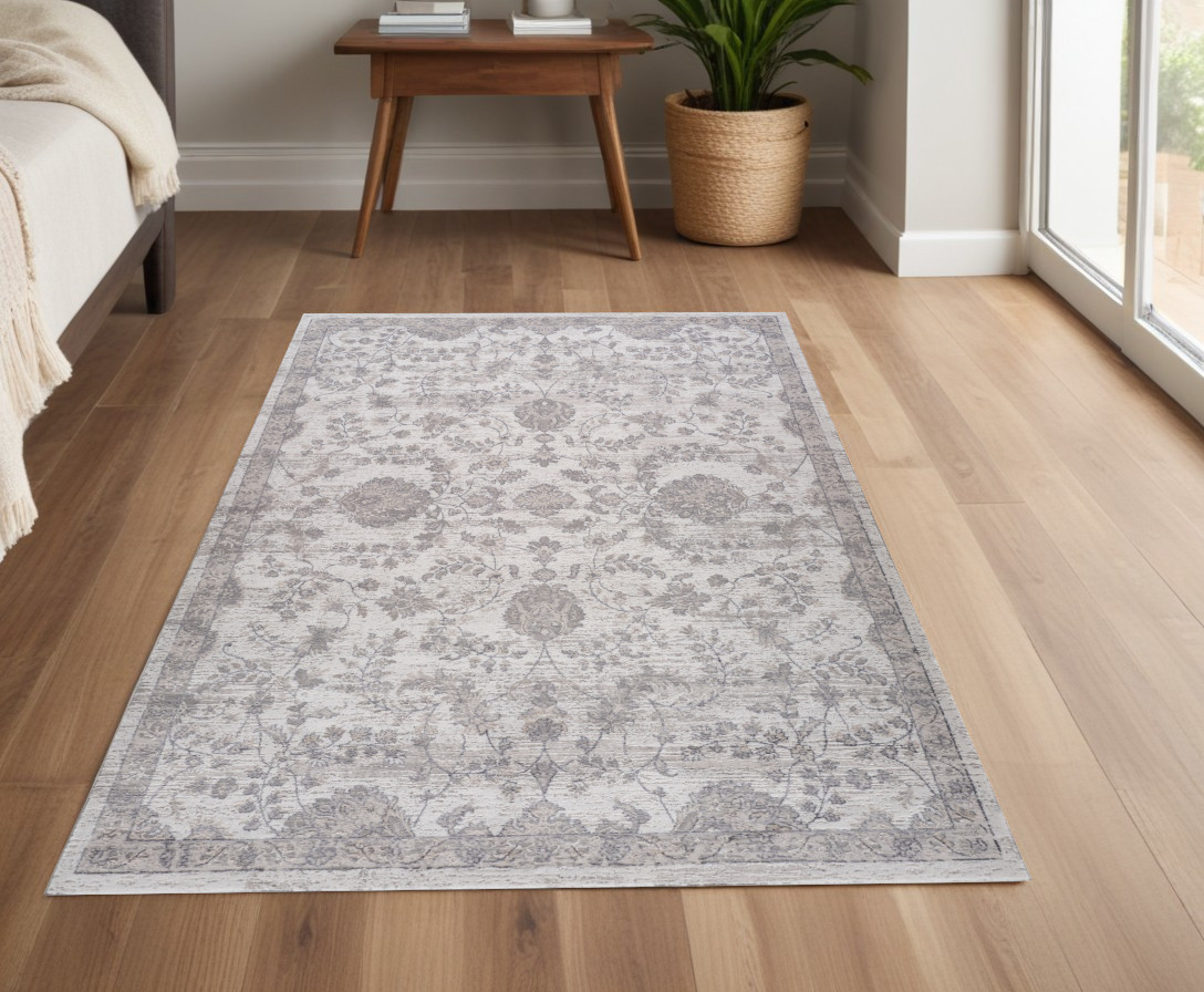 4" X 6" Beige and Gray Floral Distressed Area Rug