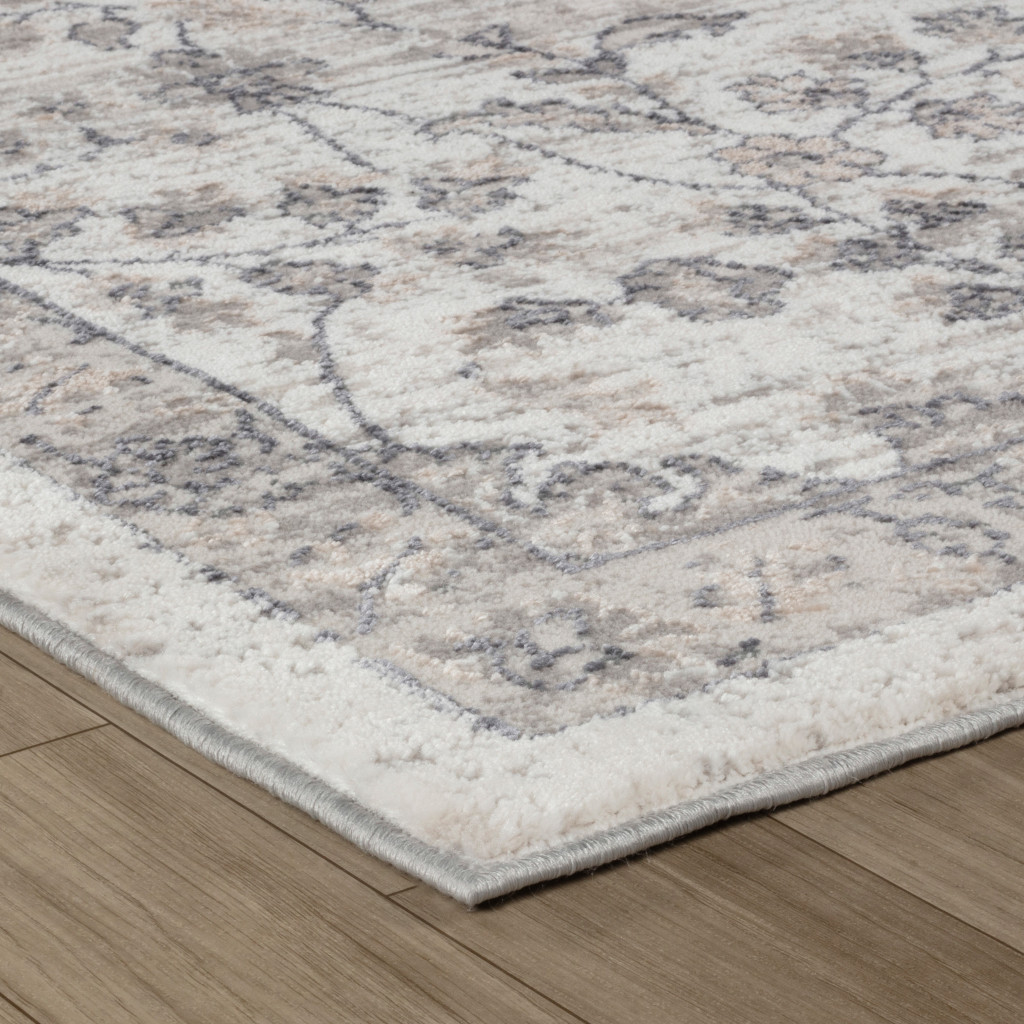 4" X 6" Beige and Gray Floral Distressed Area Rug