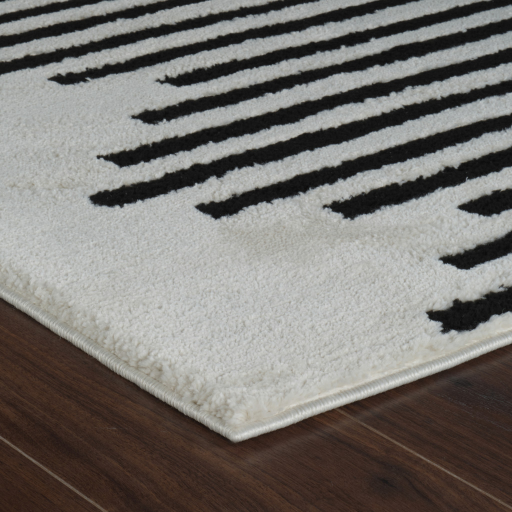 5" X 8" Cream and Black Abstract Worn Faded Area Rug
