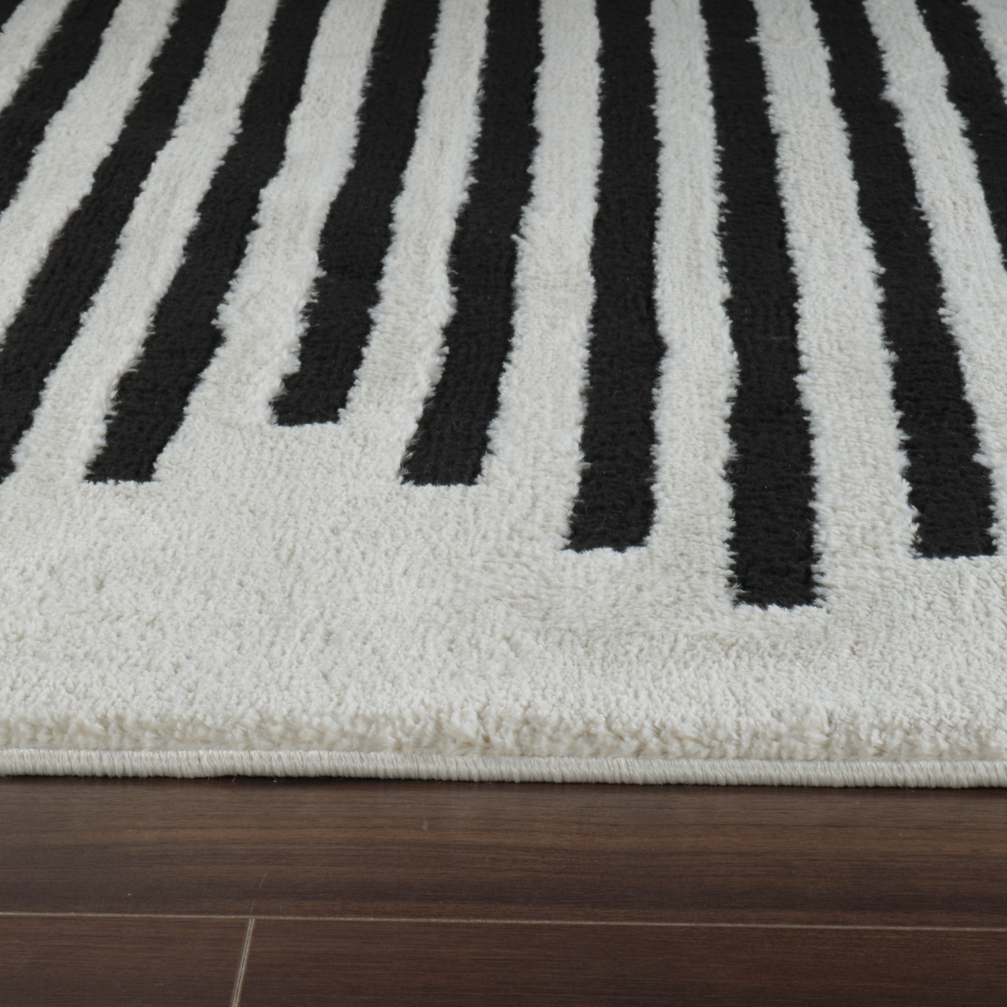 5" X 8" Cream and Black Abstract Worn Faded Area Rug