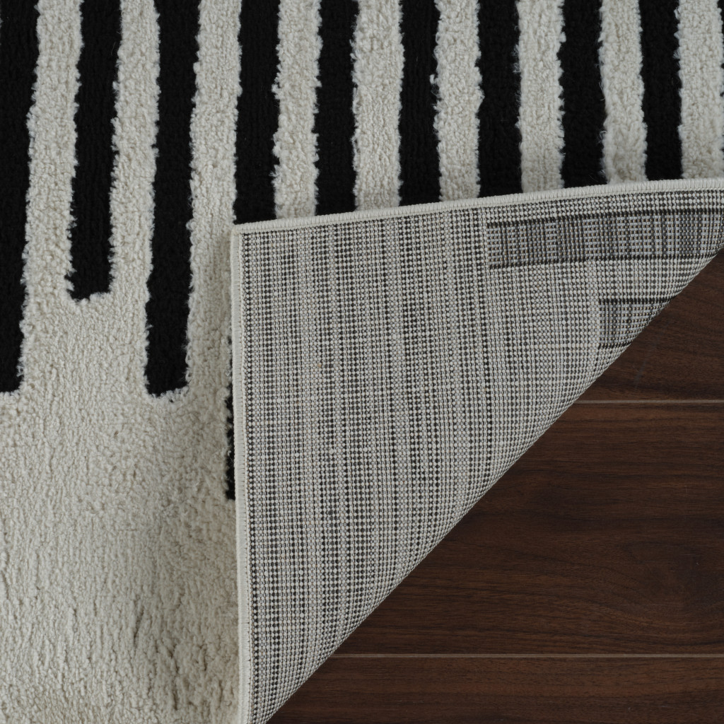 5" X 8" Cream and Black Abstract Worn Faded Area Rug