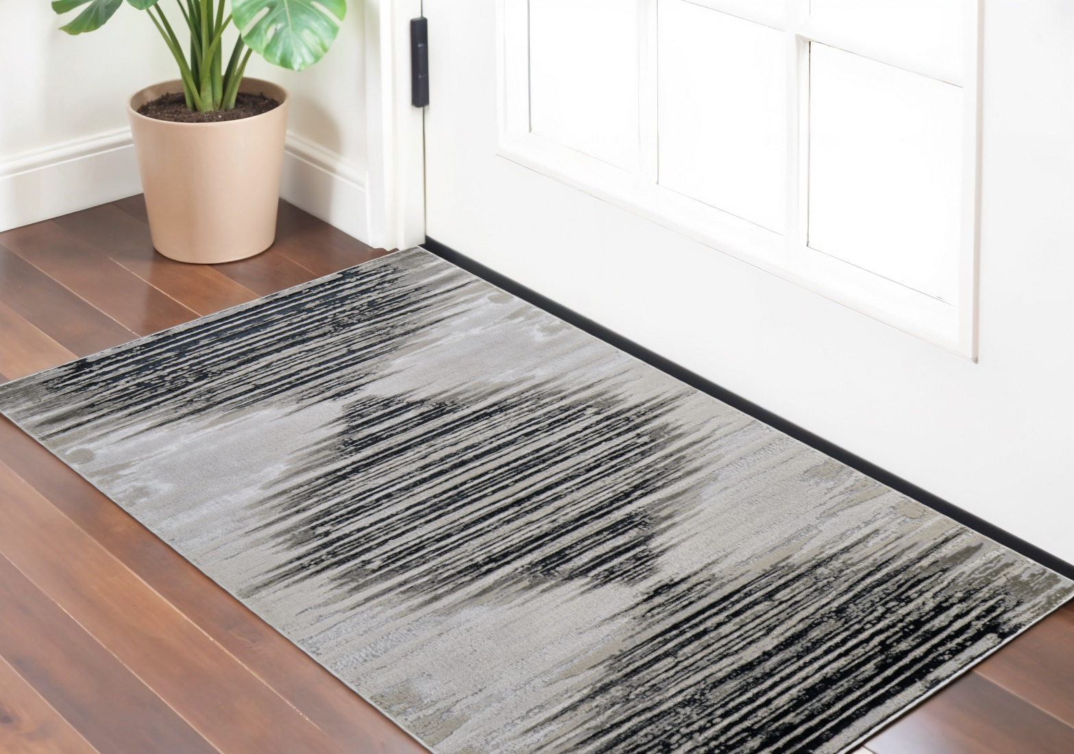 2" X 3" Black and Silver Geometric Power Loom Area Rug