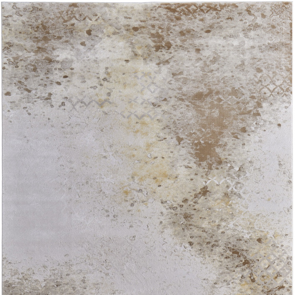 2" X 3" Tan and Ivory Abstract Power Loom Worn Faded Area Rug