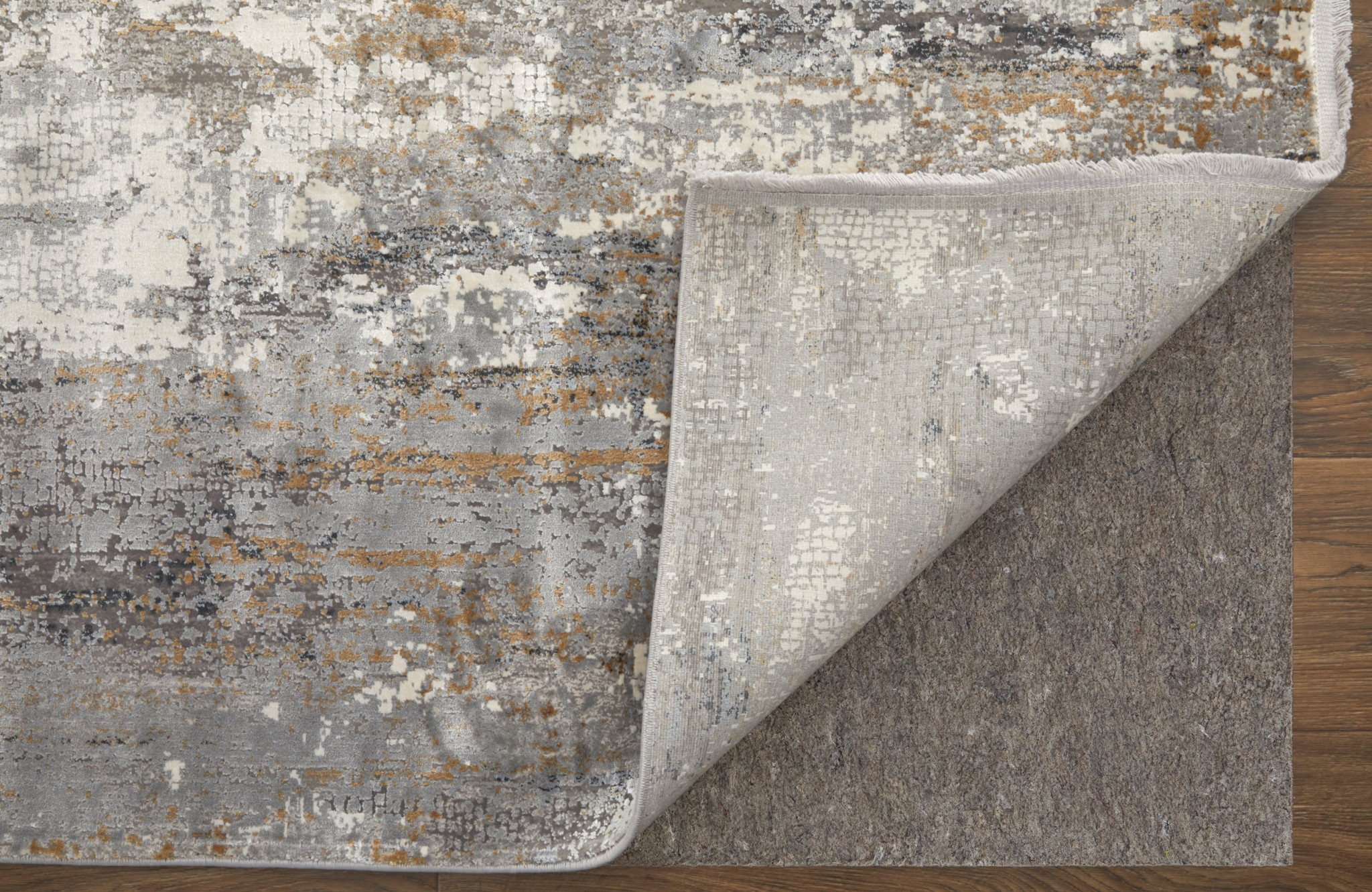 3" X 5" Gray Ivory and Gold Abstract Power Loom Area Rug With Fringe