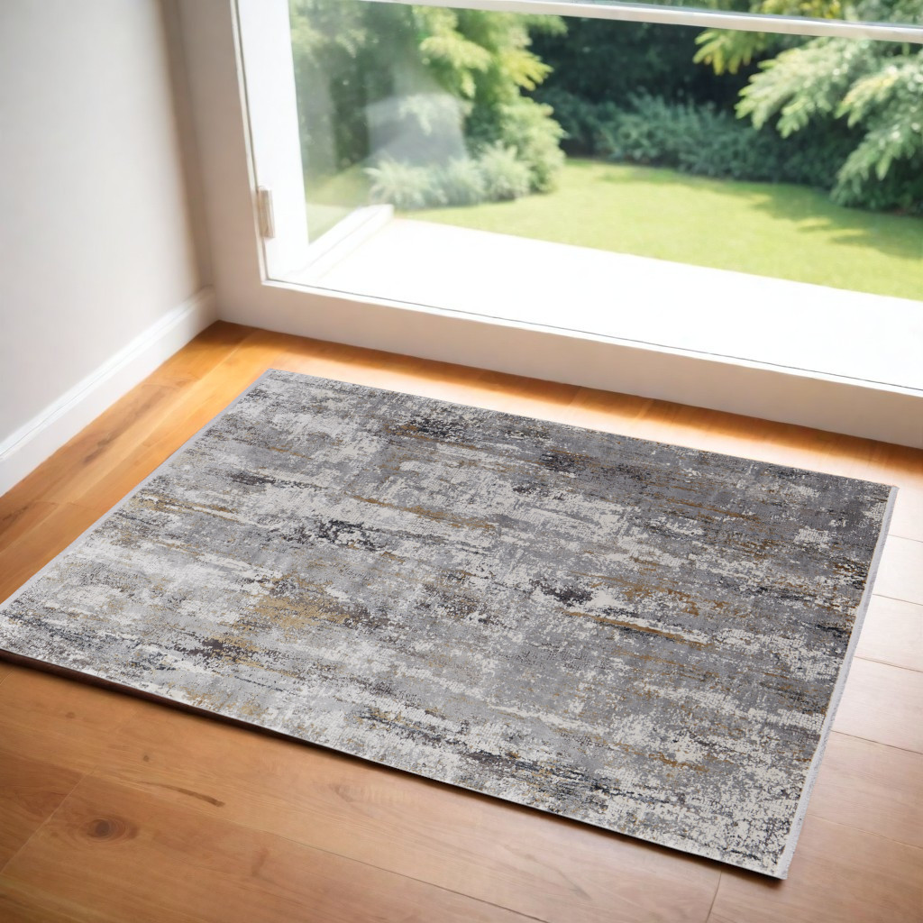 3" X 5" Gray Ivory and Gold Abstract Power Loom Area Rug With Fringe