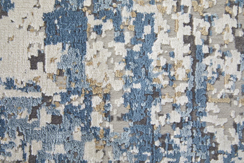 3" X 5" Ivory Tan and Blue Abstract Power Loom Area Rug With Fringe