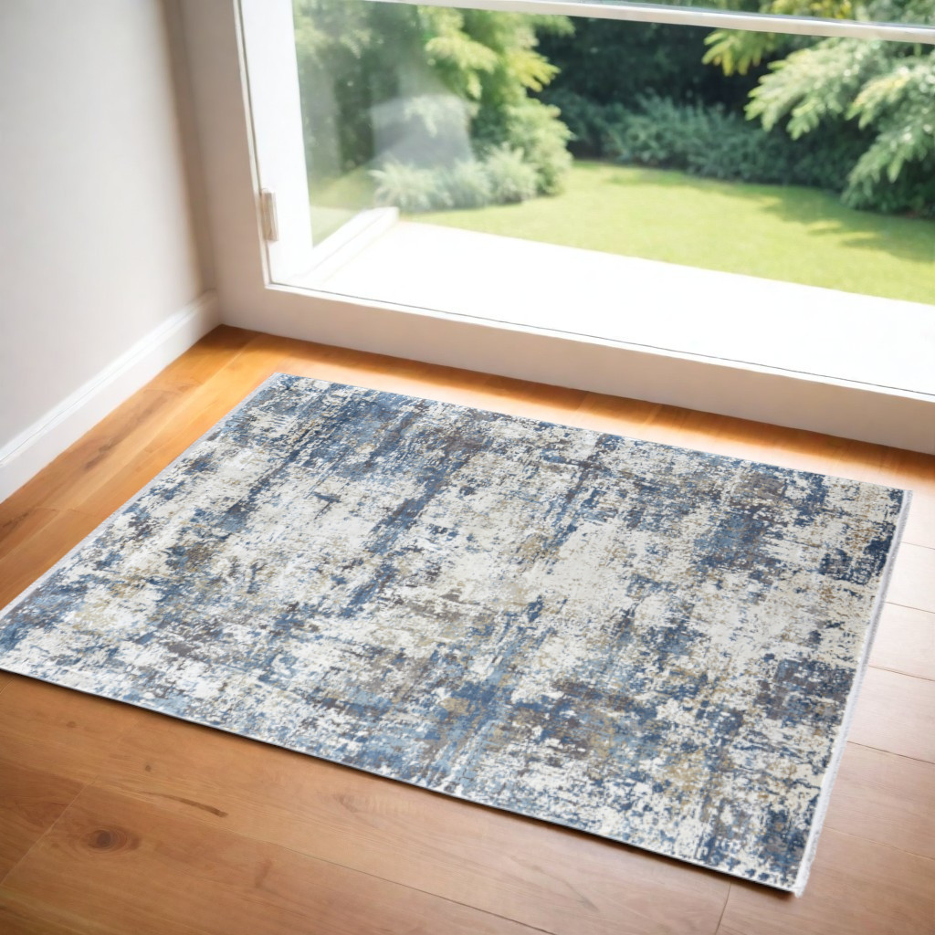 3" X 5" Ivory Tan and Blue Abstract Power Loom Area Rug With Fringe