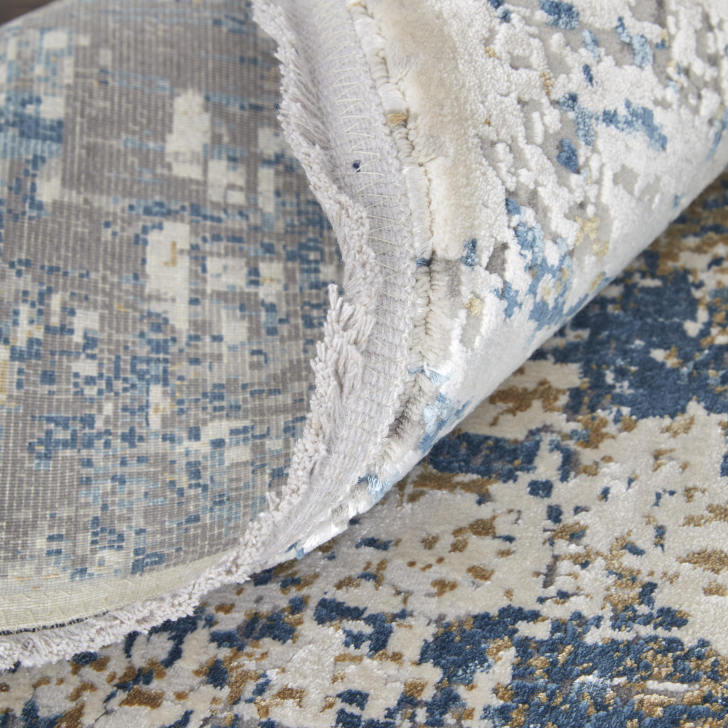 5" X 8" Ivory Tan and Blue Abstract Power Loom Area Rug With Fringe