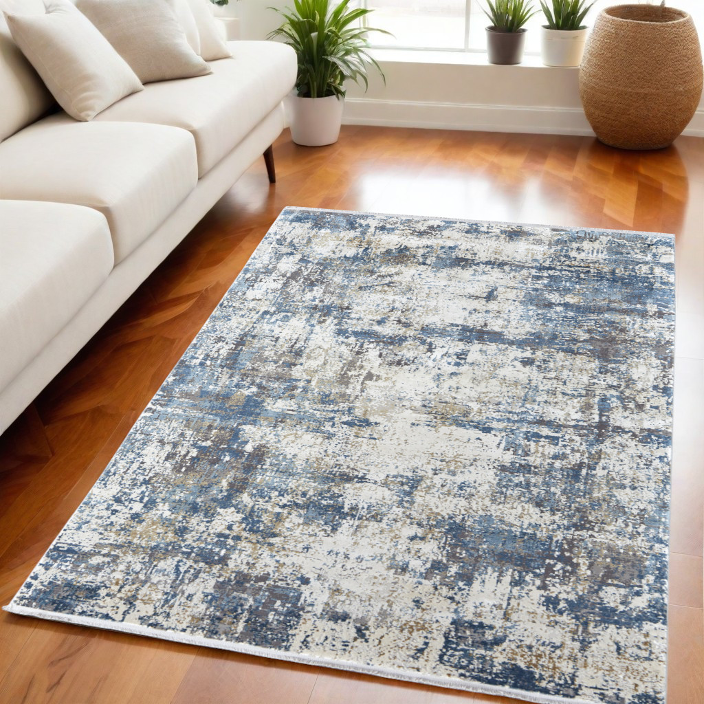 5" X 8" Ivory Tan and Blue Abstract Power Loom Area Rug With Fringe