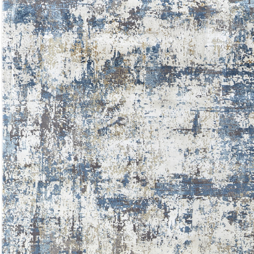 10" X 13" Ivory Tan and Blue Abstract Power Loom Area Rug With Fringe