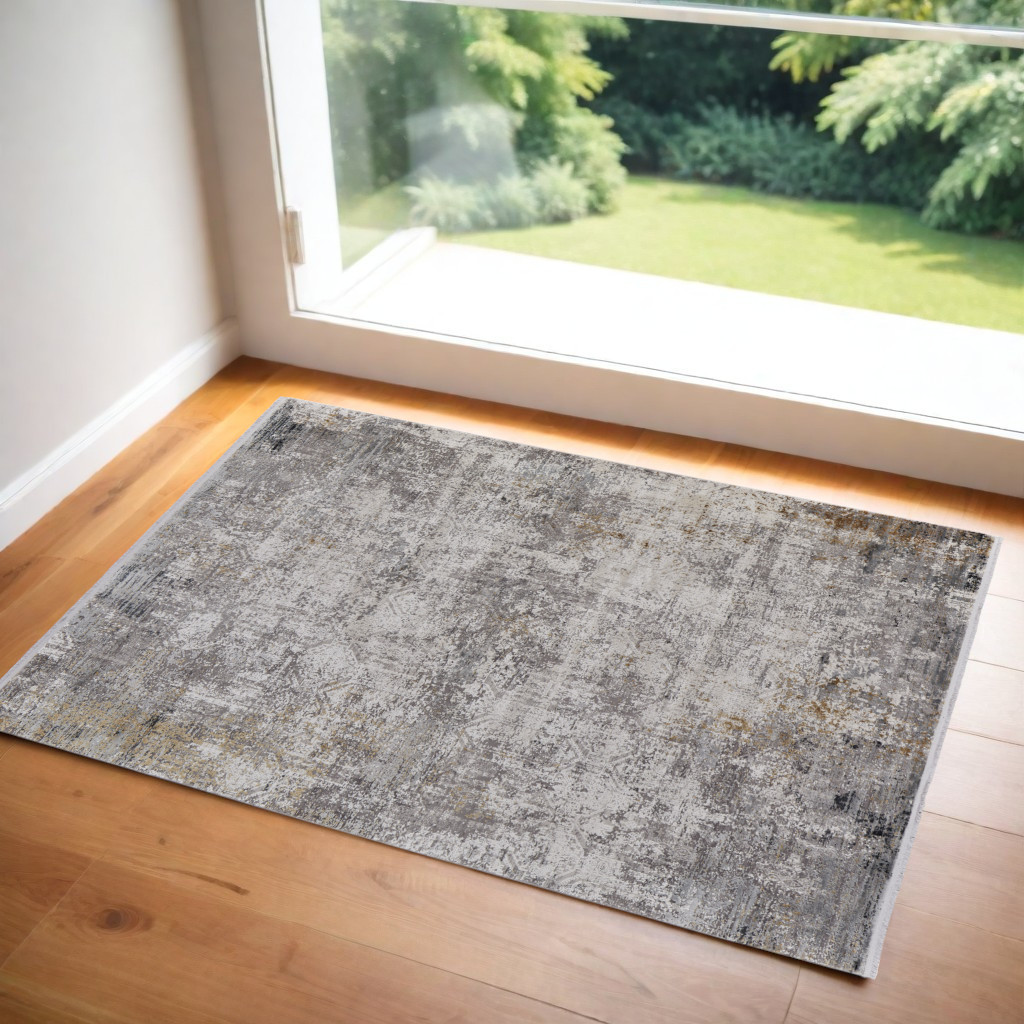 2" X 3" Ivory Taupe and Gray Abstract Power Loom Distressed Area Rug With Fringe