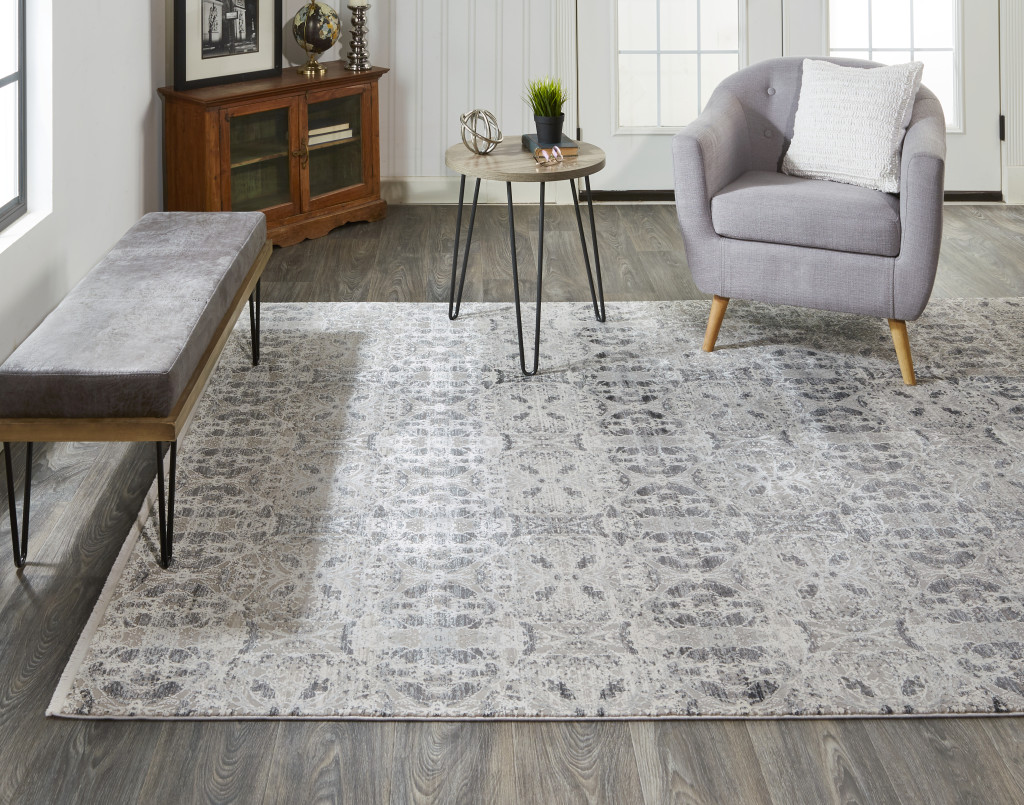 3" X 5" Ivory Taupe and Gray Oriental Power Loom Area Rug With Fringe