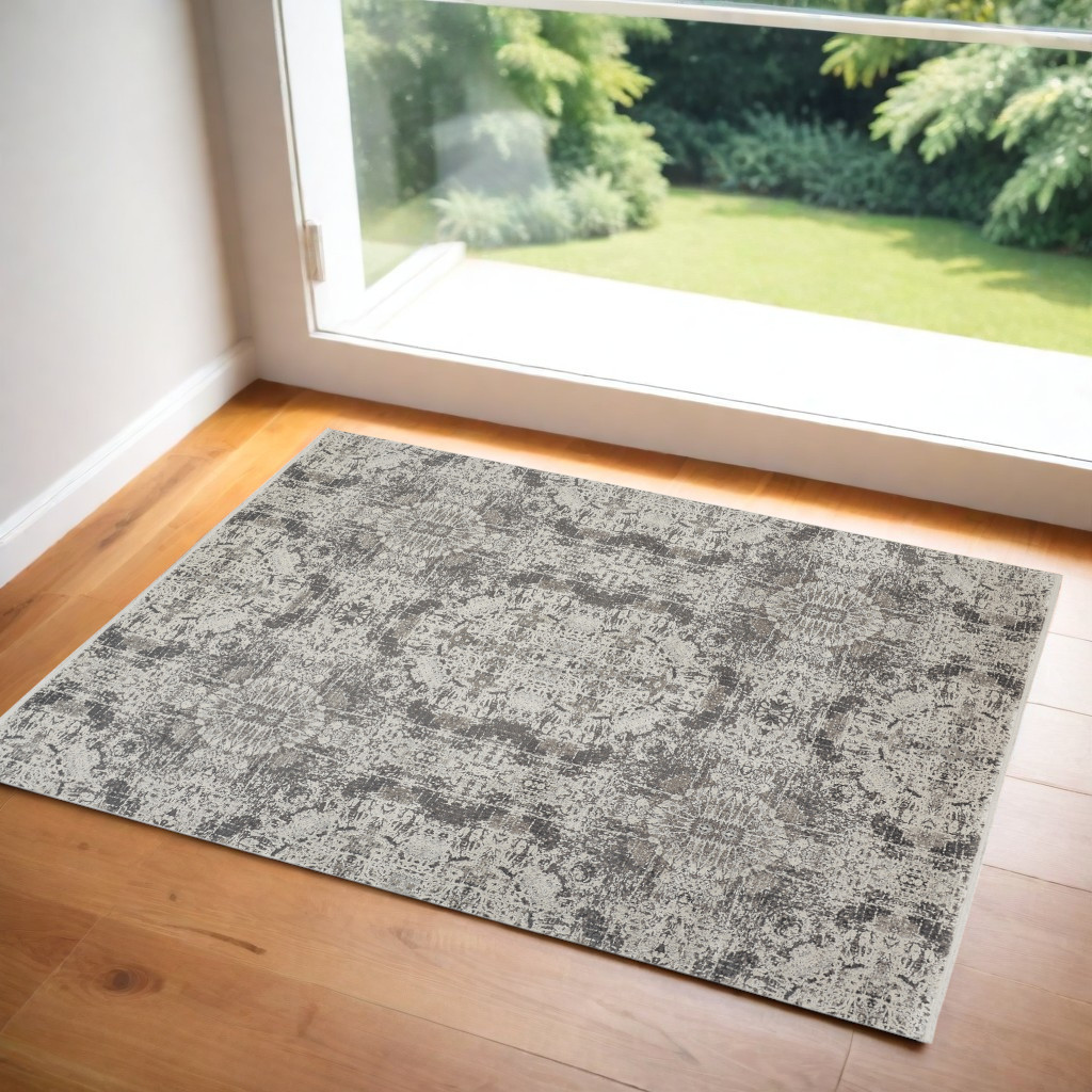 3" X 5" Ivory Taupe and Gray Oriental Power Loom Area Rug With Fringe