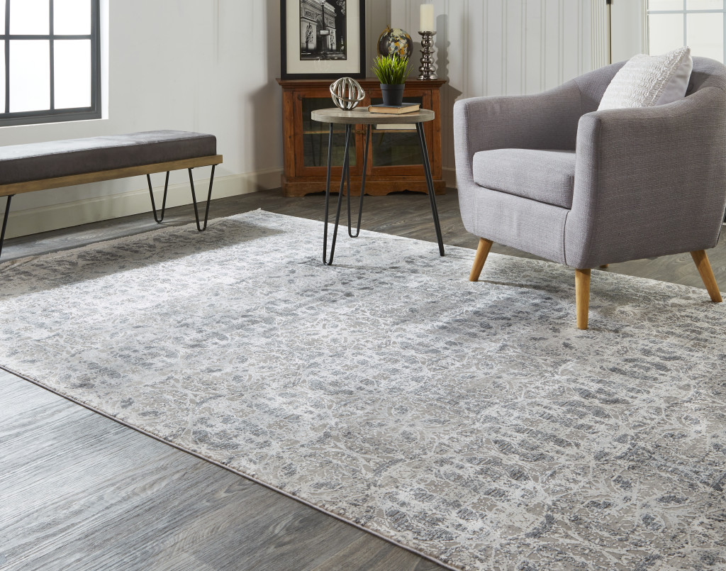 3" X 5" Ivory Taupe and Gray Oriental Power Loom Area Rug With Fringe