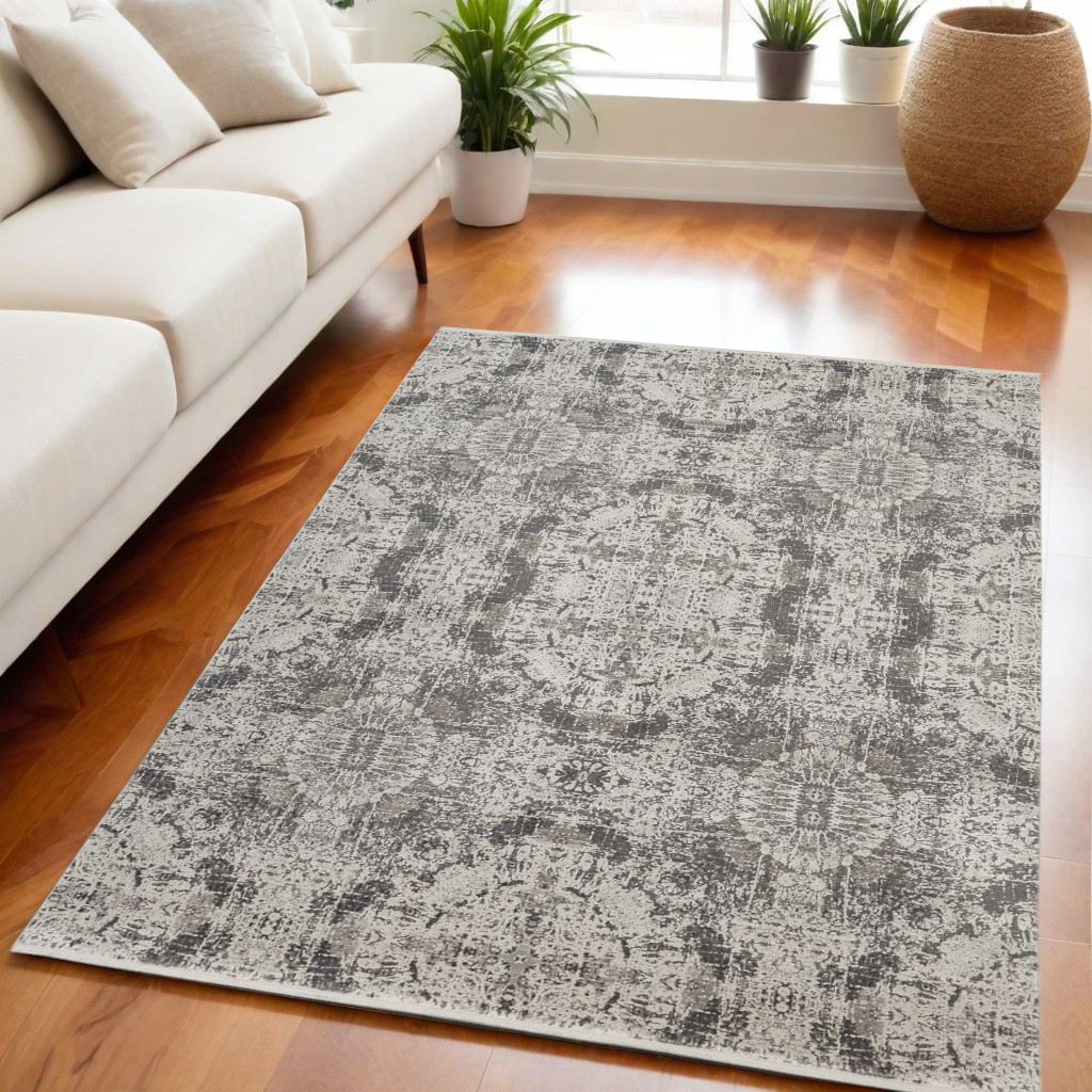 5" X 8" Ivory Taupe and Gray Oriental Power Loom Area Rug With Fringe