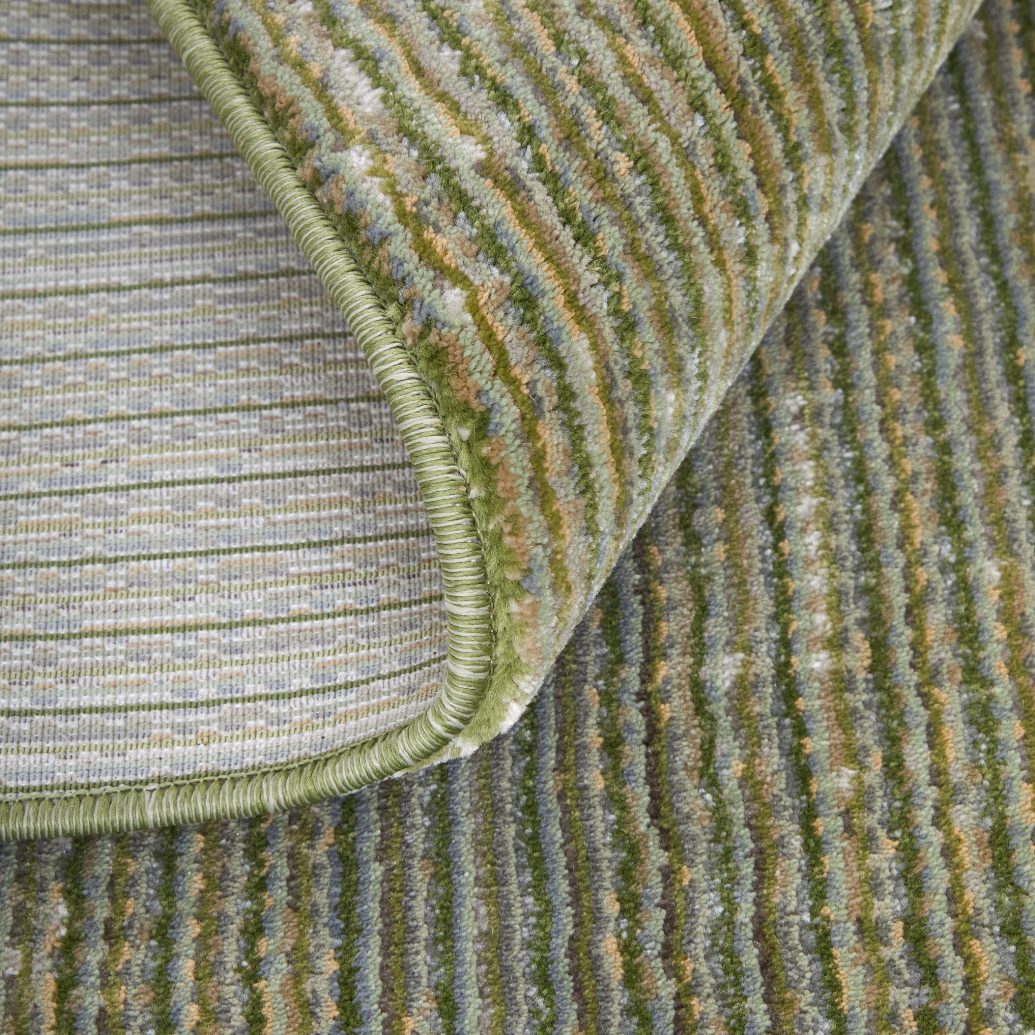 9" X 13" Tan and Green Power Loom Area Rug